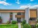 Inviting condo exterior with well-maintained landscaping and a walkway leading to the entrance at 1080 Bal Harbor Blvd # 11C, Punta Gorda, FL 33950