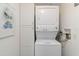 Convenient laundry area equipped with a stacked washer and dryer unit at 1080 Bal Harbor Blvd # 11C, Punta Gorda, FL 33950