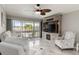 Bright living room with stylish furnishings, sliding doors to the balcony, and a modern entertainment center at 1080 Bal Harbor Blvd # 11C, Punta Gorda, FL 33950