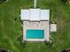 Aerial view of pool with lounging area and surrounded by green spaces at 1080 Bal Harbor Blvd # 11C, Punta Gorda, FL 33950