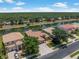 Aerial shot displays the property with a view of a canal and the surrounding neighborhood at 11982 Granite Woods Loop, Venice, FL 34292