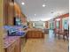 Spacious kitchen with custom cabinets, stainless steel appliances, granite counters and breakfast nook at 11982 Granite Woods Loop, Venice, FL 34292