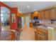 Well-equipped kitchen with stainless appliances, granite counters and an open layout at 11982 Granite Woods Loop, Venice, FL 34292