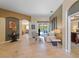 Bright and airy living room with travertine floors and direct access to the pool at 11982 Granite Woods Loop, Venice, FL 34292