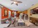 Spacious living room with bar seating and views of dining area and kitchen at 11982 Granite Woods Loop, Venice, FL 34292
