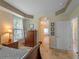 Comfortable main bedroom with neutral tones and easy access to the ensuite bathroom at 11982 Granite Woods Loop, Venice, FL 34292