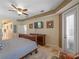 Neutral-toned main bedroom featuring access to the bathroom and outdoor access at 11982 Granite Woods Loop, Venice, FL 34292