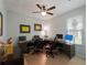Spacious office space with multiple workstations, ceiling fan, and natural light at 11982 Granite Woods Loop, Venice, FL 34292