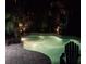 Inviting backyard pool with lush tropical landscaping, perfect for relaxing evenings at 11982 Granite Woods Loop, Venice, FL 34292