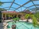 A beautiful screened-in pool and patio offer a private and refreshing outdoor retreat at 11982 Granite Woods Loop, Venice, FL 34292
