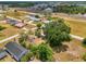 Aerial view of property showcasing spacious lot with mature trees near the highway at 12018 Saragossa Ln, North Port, FL 34287