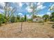 Expansive back yard featuring mature trees and plenty of room for outdoor activities at 12018 Saragossa Ln, North Port, FL 34287
