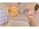 Charming bedroom with plush bed, light walls, and bright natural lighting at 12018 Saragossa Ln, North Port, FL 34287