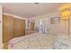 Light bedroom with closet and floral bedspread at 12018 Saragossa Ln, North Port, FL 34287