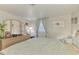 Light and airy bedroom featuring a large dresser and mirror, creating a bright, inviting space at 12018 Saragossa Ln, North Port, FL 34287