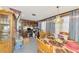 Combination dining and office area with wood furniture, a desk, and window at 12018 Saragossa Ln, North Port, FL 34287