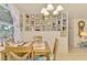 Dining room with charming decor and built in shelves at 12018 Saragossa Ln, North Port, FL 34287