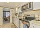 The kitchen has stainless appliances and tile backsplash at 12018 Saragossa Ln, North Port, FL 34287