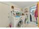 Functional laundry room with modern washer and dryer, offering convenience and efficiency at 12018 Saragossa Ln, North Port, FL 34287