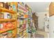 Well-stocked pantry with ample shelving for organized storage of food items and household goods at 12018 Saragossa Ln, North Port, FL 34287