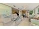 Spacious sunroom with comfortable seating and natural light, an ideal space for relaxation at 12018 Saragossa Ln, North Port, FL 34287