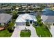 Stunning waterfront home with lush landscaping, a spacious driveway, and convenient access to the canal at 1306 Osprey Dr, Punta Gorda, FL 33950