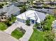 Beautiful waterfront home with a spacious driveway, manicured landscaping, and a two-car garage at 1306 Osprey Dr, Punta Gorda, FL 33950