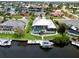 Waterfront home featuring a screened lanai, private pool, dock, and boat lift, offering convenient access to waterways at 1306 Osprey Dr, Punta Gorda, FL 33950