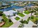 Beautiful waterfront home with well-manicured landscaping, a spacious driveway, and convenient access to the canal at 1306 Osprey Dr, Punta Gorda, FL 33950
