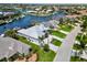 Waterfront property with lush landscaping, boat dock, and screened-in lanai in an upscale neighborhood at 1306 Osprey Dr, Punta Gorda, FL 33950