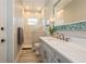 Well-lit bathroom with modern shower and stylish vanity, offering comfort and sophistication at 1306 Osprey Dr, Punta Gorda, FL 33950