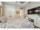 Comfortable bedroom with built-in desk and ample natural light for a functional and serene space at 1306 Osprey Dr, Punta Gorda, FL 33950