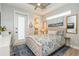 Cozy bedroom with ensuite bathroom and ample natural light creates a relaxing retreat at 1306 Osprey Dr, Punta Gorda, FL 33950