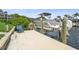 A private boat lift offers convenient access to the waterways, and is adjacent to an Adirondack chair at 1306 Osprey Dr, Punta Gorda, FL 33950