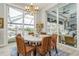 Open dining area with waterfront views and wicker chairs for stylish, relaxed living at 1306 Osprey Dr, Punta Gorda, FL 33950