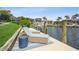 Waterfront home features a private dock with boat lift and comfortable lounge chairs for enjoying the view at 1306 Osprey Dr, Punta Gorda, FL 33950