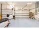 Spacious three car garage with epoxy flooring and ample room for parking and storage at 1306 Osprey Dr, Punta Gorda, FL 33950