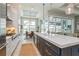 Spacious kitchen features a large island, modern appliances, and access to a dining area with scenic views at 1306 Osprey Dr, Punta Gorda, FL 33950