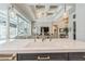 Modern kitchen with island sink, quartz counters, and designer lighting pendants at 1306 Osprey Dr, Punta Gorda, FL 33950