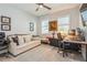 Comfortable living room with a cozy couch and dedicated workspace for relaxation and productivity at 1306 Osprey Dr, Punta Gorda, FL 33950