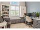 Bright office with custom built-ins and a comfortable seating area creates an inviting workspace at 1306 Osprey Dr, Punta Gorda, FL 33950