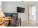 Functional home office with dual monitors, modern desk, and neutral walls for a productive workspace at 1306 Osprey Dr, Punta Gorda, FL 33950