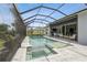 Full outdoor living space showcasing pool, spa, outdoor dining, and lounging area at 1306 Osprey Dr, Punta Gorda, FL 33950