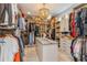 Spacious walk-in closet with custom shelving and central island for organized storage at 1306 Osprey Dr, Punta Gorda, FL 33950