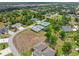 Aerial view showcasing the well-planned community layout and residential architecture in a green environment at 1327 Hedgewood Cir, North Port, FL 34288