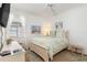 Bedroom with bright natural light, a ceiling fan, and neutral decor creating a peaceful, inviting atmosphere at 1327 Hedgewood Cir, North Port, FL 34288