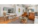 Open living area with hardwood floors, modern decor, and seamless transition to the kitchen at 1327 Hedgewood Cir, North Port, FL 34288