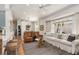 Spacious living room with hardwood floors, comfortable seating, and abundant natural light at 1327 Hedgewood Cir, North Port, FL 34288