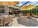 Spacious paver patio with dining and lounge areas, perfect for outdoor gatherings and relaxation at 1327 Hedgewood Cir, North Port, FL 34288