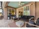 Comfortable outdoor patio with seating and grill, perfect for enjoying outdoor meals and lounging at 1327 Hedgewood Cir, North Port, FL 34288